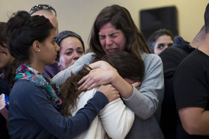Family members and relatives of Israeli Hadar Buchris mourn during her funeral ceremony in Jerusalem, Israel, 23 November 2015. Hadar Buchris, 21, was killed by a Palestinian attacker who stabbed her to death at the central bus station in the Gush Etzion settlement block junction in the West Bank on 22 November.  EPA/ABIR SULTAN