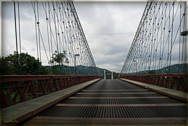The Wheeling Suspension Bridge is a suspension bridge spanning the main channel of the Ohio River at Wheeling, West Virginia. It was the largest suspension