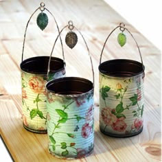 Re-purposed tin cans made by decoupaging napkins