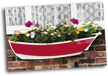 ... planters in the shape of a traditional open topped fishing boat
