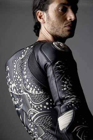 The white tattoo designs were formed by cutting away the black outer layer 