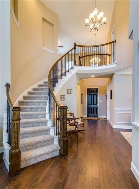 grand story entry curved staircase