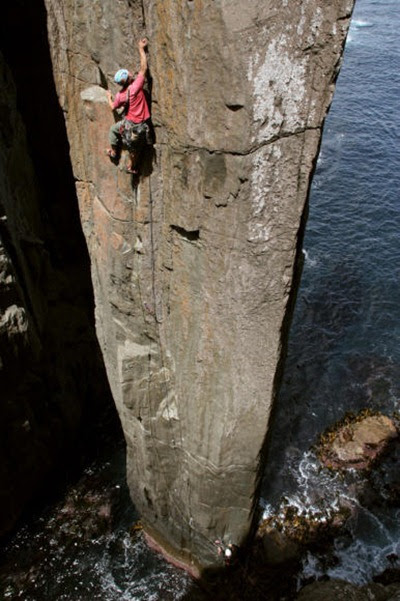Erik Carleberg, of Sweden, nearing the top of The Totem Pole's first pitch variation, 24, and thankful for not dropping any bolt plates into the ocean.