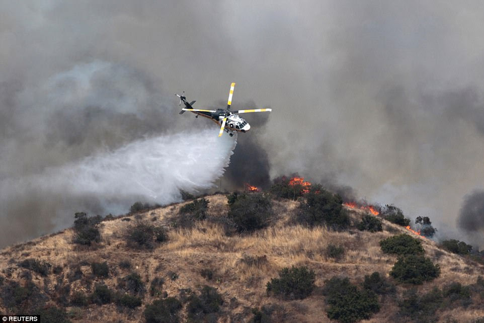 A helicopter helps battle the blaze in Burbank