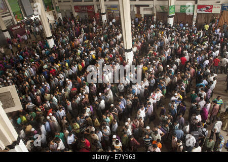 People queue to buy railway tickets at ticket office in 