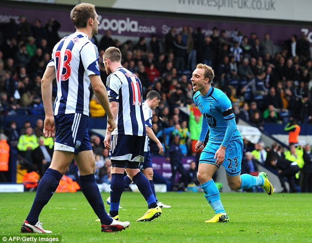 Jubilation: Tottenham midfielder Christian Eriksen (right) celebrates scoring against West Brom