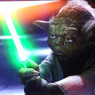 Yoda looks tough over the orchestra. StarWarsinconcert.com