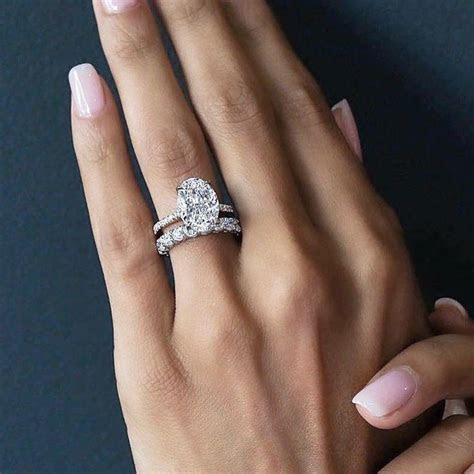 Black diamond engagement rings are trending! wow these oval wedding rings really are amazing Pic