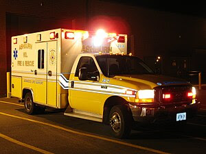 An American ambulance also with all its lights...