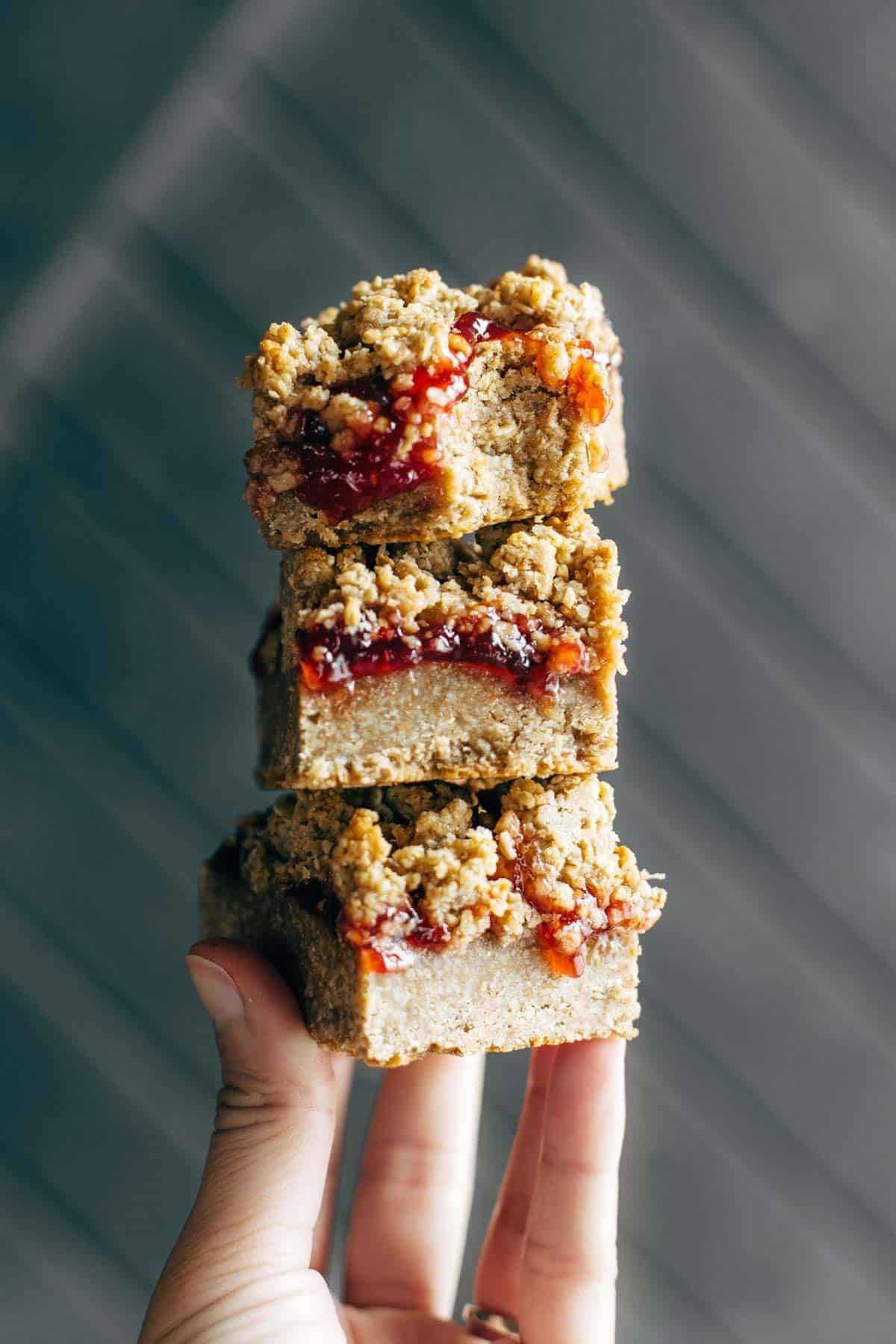 Strawberry Oat Crumble Bars - simple vegan dessert / snack bars! made with oats, sunflower seeds, coconut oil, maple syrup, and jam. | pinchofyum.com
