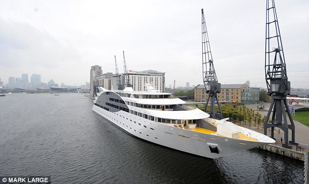 The bar, restaurant and top deck Sky Bar (all open to non-staying guests) are in the stern of the ship, and gaze towards the city framed by the steely grey cranes lining the dock