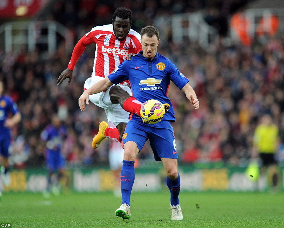 Stoke's Mame Diouf (left) could have doubled Stoke's lead when he dispossessed Jonyn Evans (right) to have a shot on goal inside the box