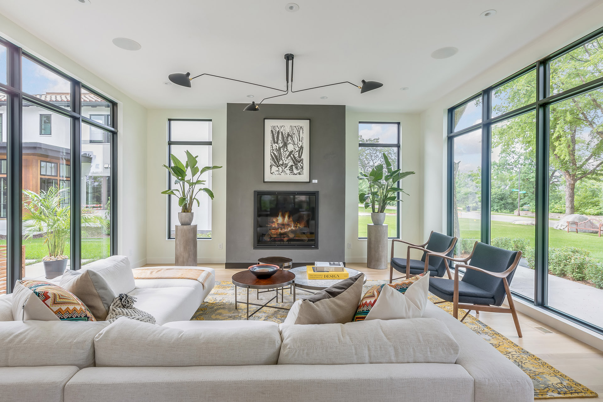 Living Room With Fireplace And Floor To Ceiling Windows Detail Homes