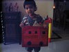 Wearing a bus that Appa and Amma made for 'Vehicle Day' at school