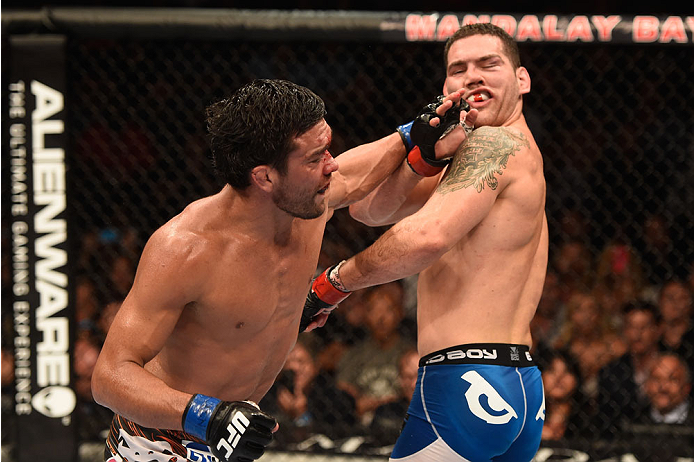 LAS VEGAS, NV - JULY 05:  (R-L) UFC middleweight champion Chris Weidman exchanges punches with Lyoto Machida in their UFC middleweight championship fight at UFC 175 inside the Mandalay Bay Events Center on July 5, 2014 in Las Vegas, Nevada.  (Photo by Donald Miralle/Zuffa LLC/Zuffa LLC via Getty Images)