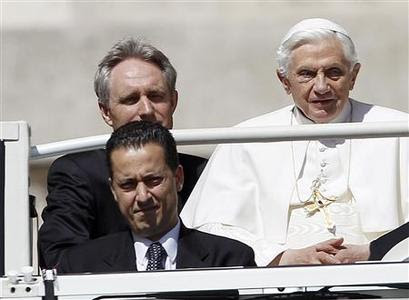 The Pope's butler, Paolo Gabriele (bottom L) arrives with Pope Benedict XVI (R) at St. Peter's Square in Vatican, in this file photo taken May 23, 2012. The butler who serves in the apartments of Pope Benedict XVI was arrested on Friday in connection with an investigation into leaks of confidential documents, a senior Vatican source said. REUTERS/Alessandro Bianchi/Files