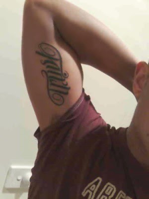 This ambigram as a finished tattoo! One word reads as the other when flipped 