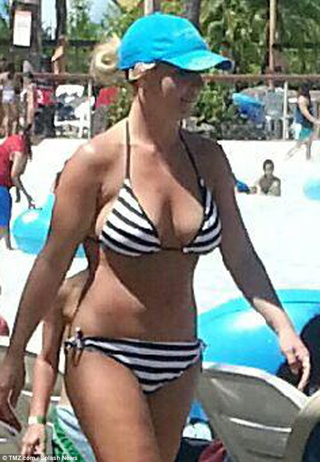 Whoa mama! Britney Spears flaunted her trim bikini body on Tuesday as she enjoyed some fun in the sun with her sons at Six Flags Hurricane Harbor in Valencia, California
