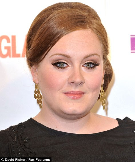 Competition: Adele's look may be worlds away from Lady Gaga's, but she will prove stiff competition at this year's VMAs, where she has been nominated for sevevn awards to Gaga's four.