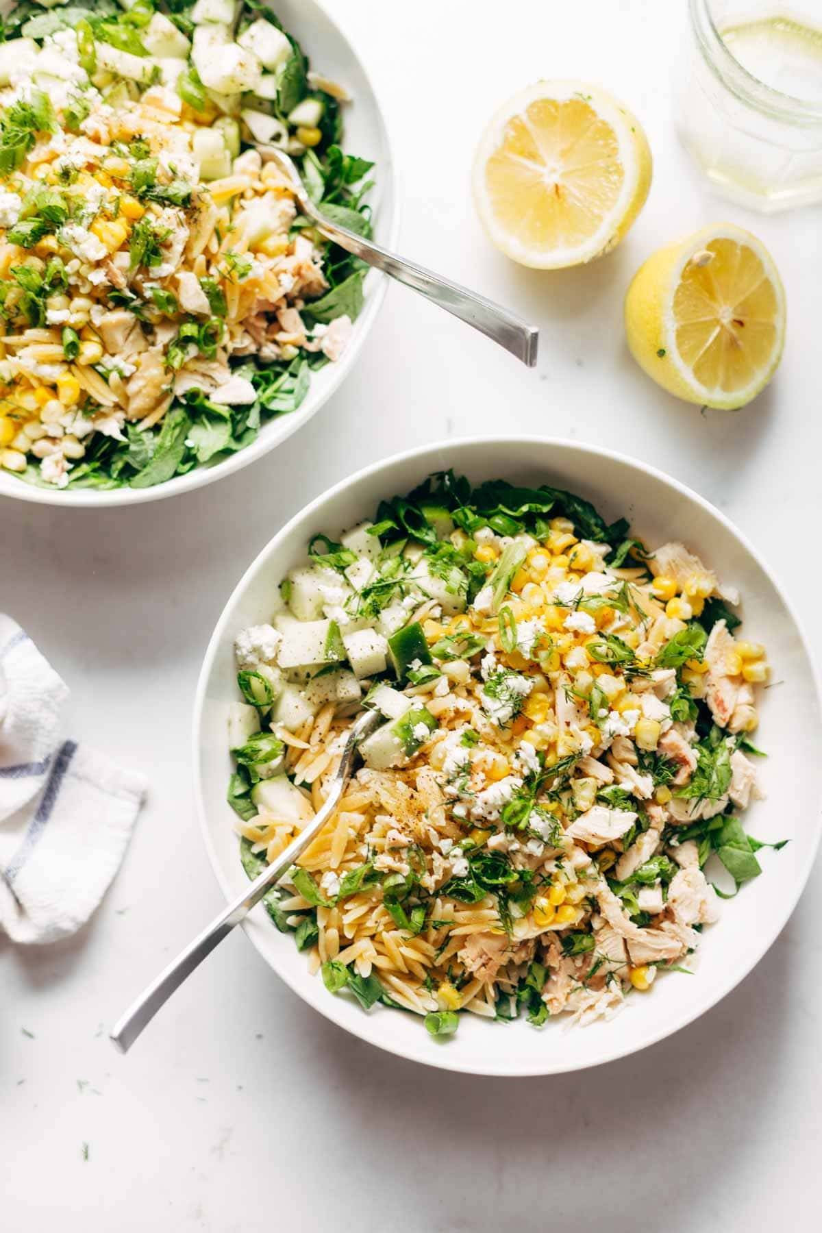 Orzo Summer Salad! With chicken and orzo, loaded with fresh veggies, and finished with a zippy lemon dressing and goat cheese. | pinchofyum.com