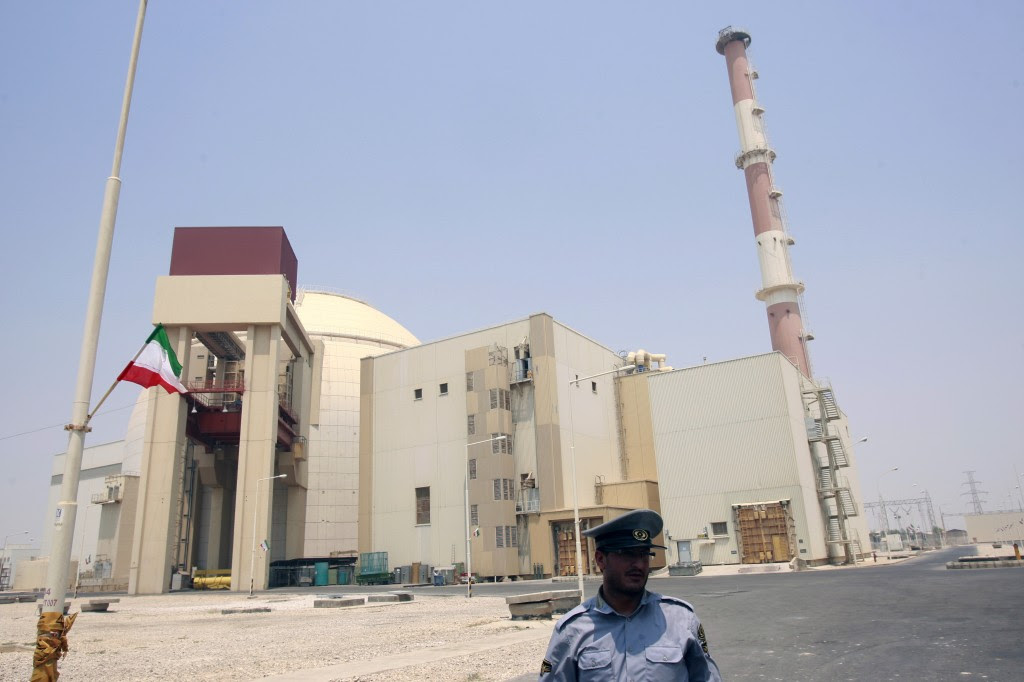 A security official talks to journalists in front of Bushehr main nuclear reactor, 1,200 km (746 miles) south of Tehran.