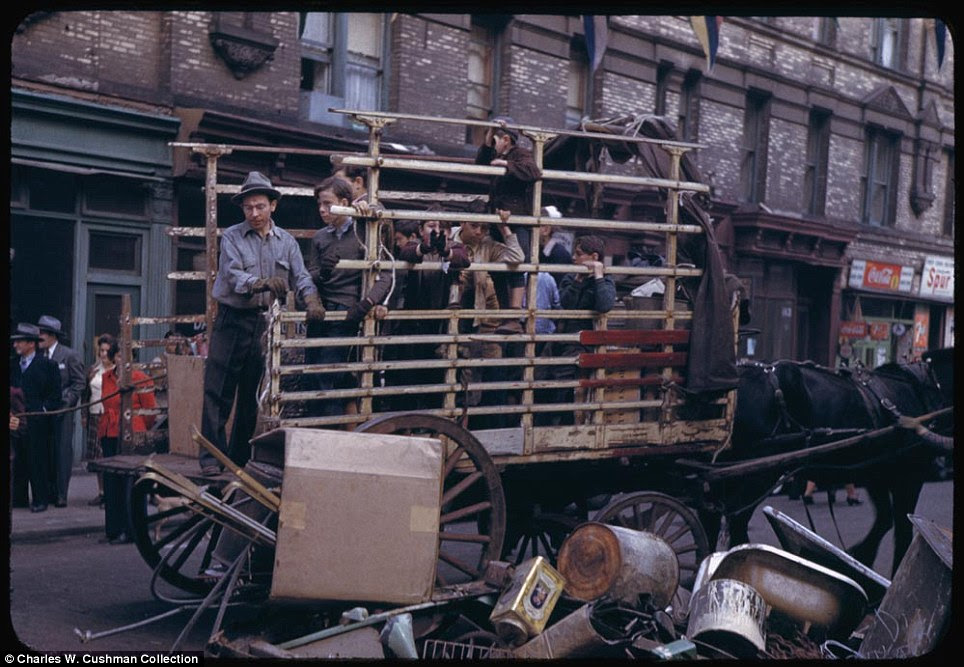 Horse and cart: Men and boys are seen collecting salvage on the Lower East Side on October 4, 1941