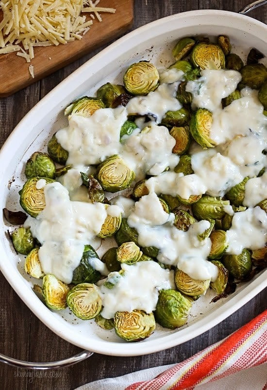 Brussels Sprouts Gratin are the perfect Holiday side dish! The brussels sprouts are roasted until crisp, then topped with a light cheese sauce made with Gruyere and parmesan, and baked until brown and bubbling. If you are as obsessed with brussels sprouts as I am, you'll love these.