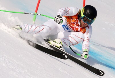 United States' Andrew Weibrecht passes a gate to win the silver medal in the men's super-G at the Sochi 2014 Winter Olympics, Sunday, Feb. 16, 2014, in Krasnaya Polyana, Russia. (AP Photo/Charles Krupa)