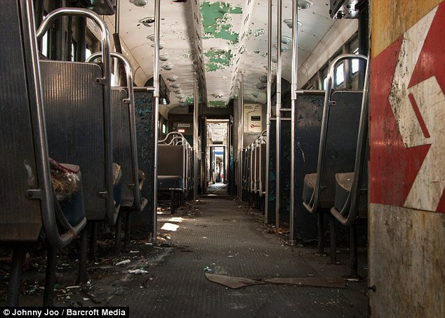 Ghost: Once filled with people, the trains sit decaying on winding tracks stretching through the snowy forest