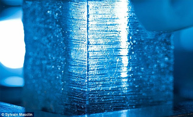 An ice core section (picutred) is simultaneously analysed for a variety of elements and chemical species in DRI's ultra-trace ice core laboratory while slowly melting the ice on a heated melter plate