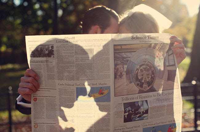 couple reading newspaper