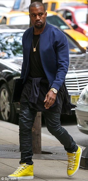 Lunchtime rendezvous: Kim Kardashian and Kanye West both arrived at the same Manhattan hotel this afternoon, stayed for an hour then left... by separate doors 