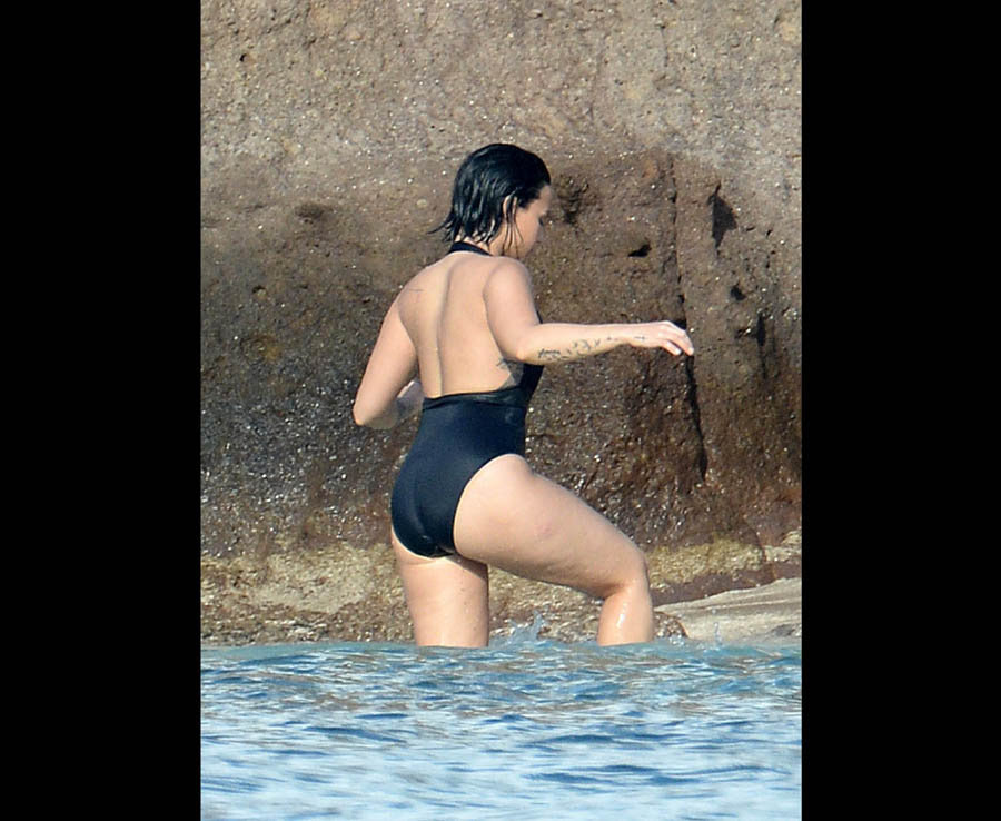 Demi Lovato Wears A Black One Piece Swimsuit While She And And Boyfriend Wilmer Valderrama Kiss And Embrace Each Other While Swimming In The Ocean In St. Bart's