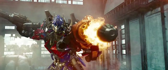 Optimus Prime about to bust a cap in a Decepticon's ass...