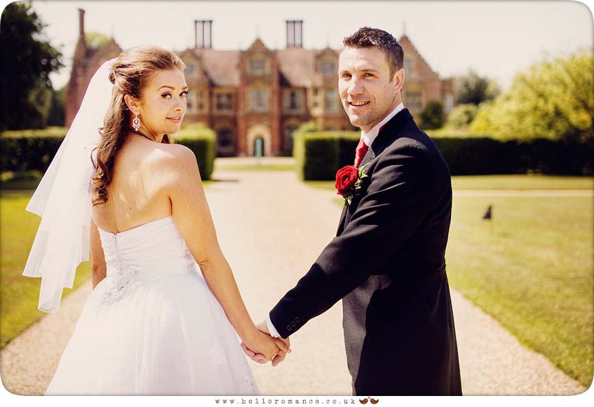 Bride and Groom looking over shoulder at Haughley Park Barn Vintage Alternative Suffolk Wedding Photography - www.helloromance.co.uk