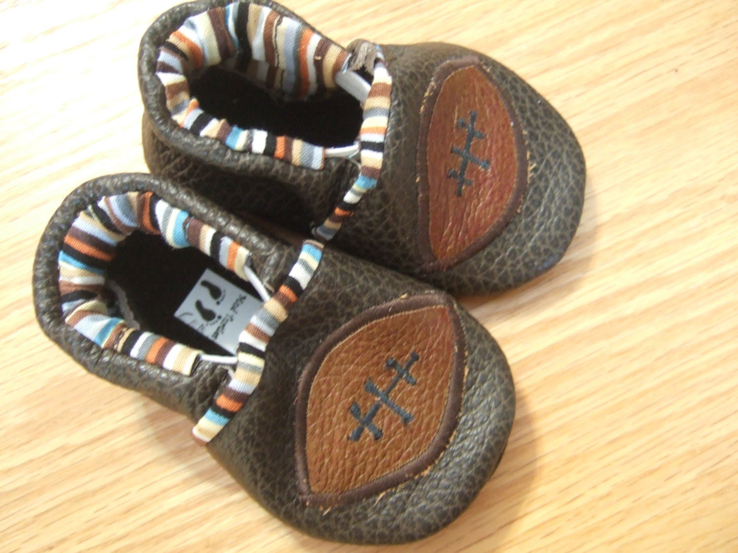 newborn baby shoes with footballs