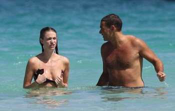 Julie Henderson displays a Yellow Bikini as she shares a romance in Miami