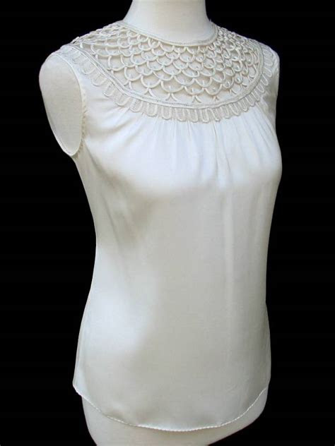 If you've decided to cut your cable bill, you'll be happy to read that you can get access to fox news without cable. ELIE TAHARI â¢ Ivory Silk Loop Detail SIVAN Blouse Top