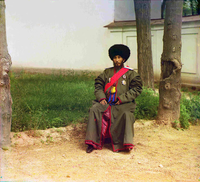 Isfandiyar Jurji Bahadur, Khan of the Russian protectorate of Khorezm (Khiva, now a part of modern Uzbekistan), full-length portrait, seated outdoors, ca. 1910.