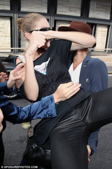 Tactile: As she walked to the car, a fan who had been waiting for her grabbed her from behind and picked her up