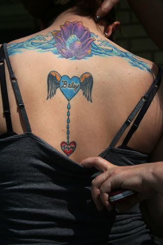Heart and Lotus Tattoo on the Back Women 