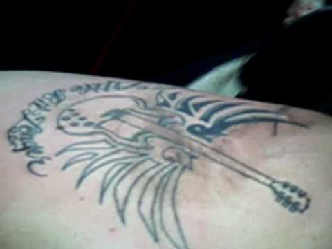 this was me getting my first tattoo in harvard square. its a guitar with