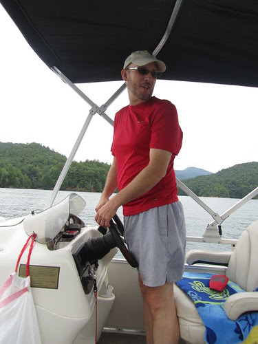 Mr. Dell steers the boat