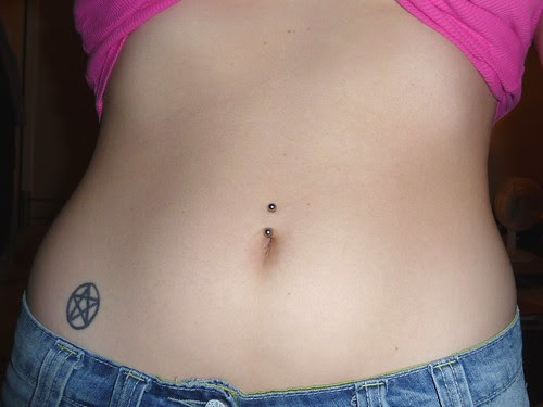  Navel Piercing and Pentagram Tattoo 