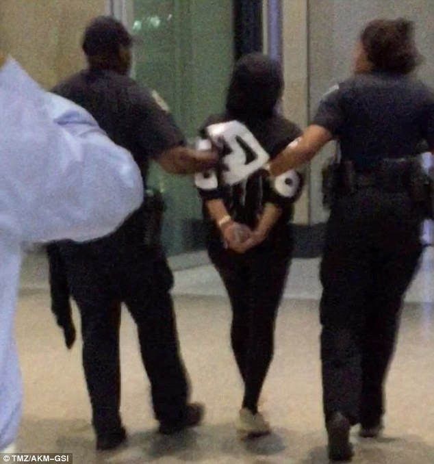 Handcuffed: The Lashed salon owner - born Angela White - admitted to taking Xanax and drinking alcohol when she 'caused a disturbance' on the Delta flight