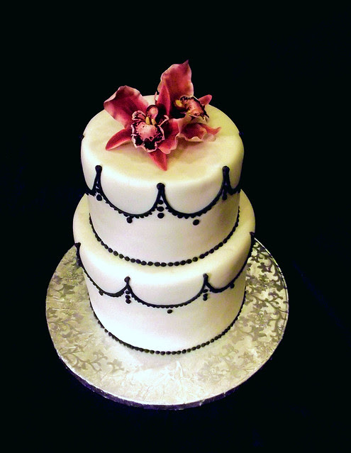 Nov 4 2011 Black and white wedding cake with red orchid sugar flowers