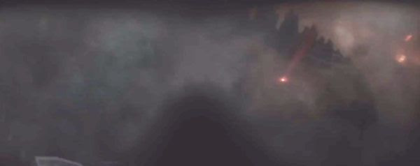 H.A.L.O. jumpers descend upon Godzilla as he lurks within the smoky remains of a decimated city in 2014's GODZILLA.