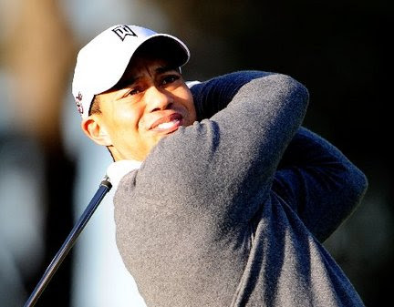 tiger woods scandal pictures. Tiger Woods practicing outside