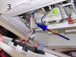 Unlatch the plug with the screwdriver