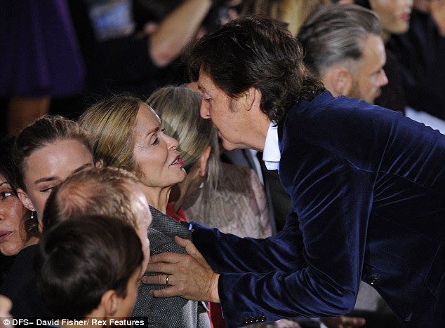 Schmoozing: Sir Paul proved himself to be quite the darling of the fashion crowd, greeting former Bond girl Barbara Bach with a kiss